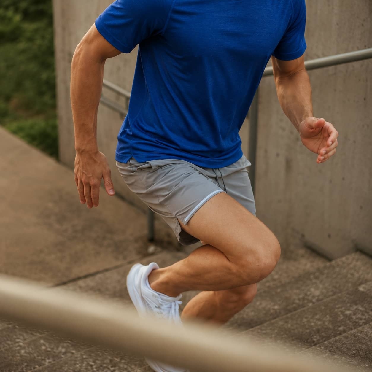 Person running upstairs during injury rehabilitation and movement correction training.